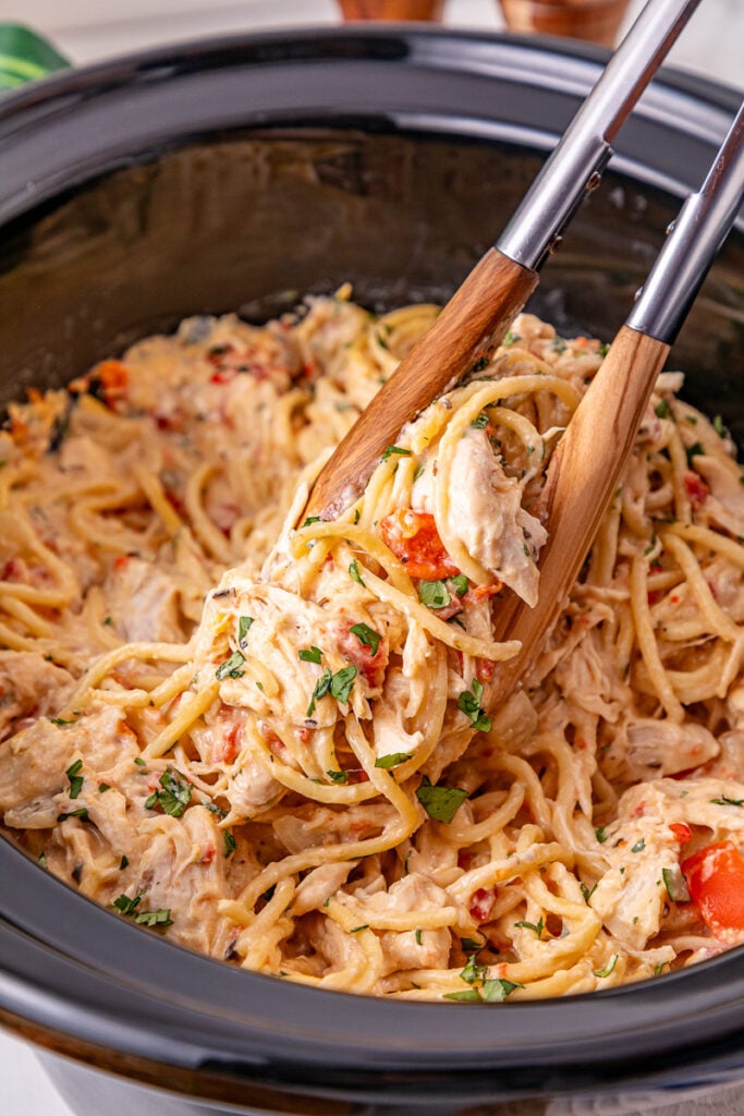 Crockpot chicken spaghetti in slow cooker ready to be served.