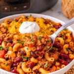 Crockpot chili mac served in a white bowl.