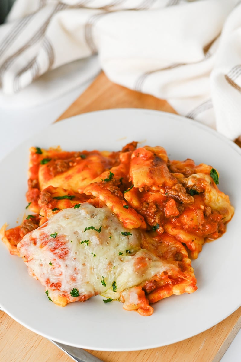 Serving of ravioli lasagna on a white plate.