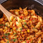 Crockpot taco pasta in slow cooker ready to be served.