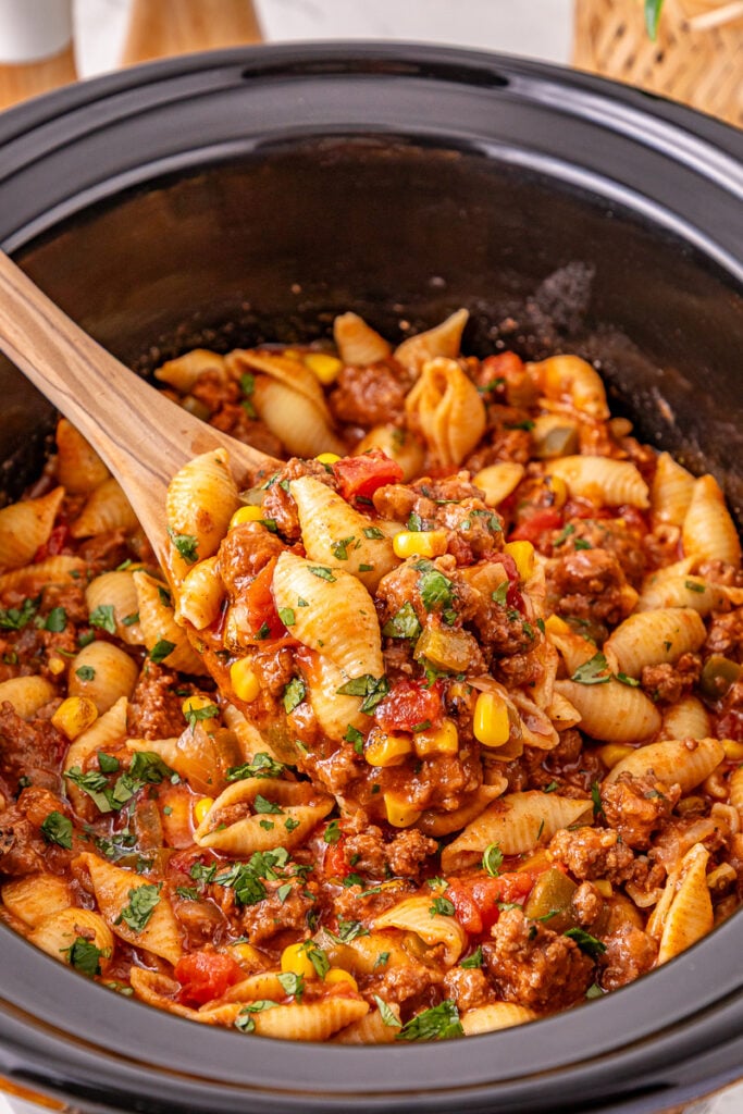 Crockpot taco pasta in slow cooker ready to be served.