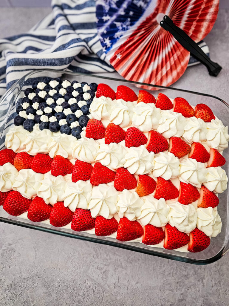 American flag cake on counter ready to be served.