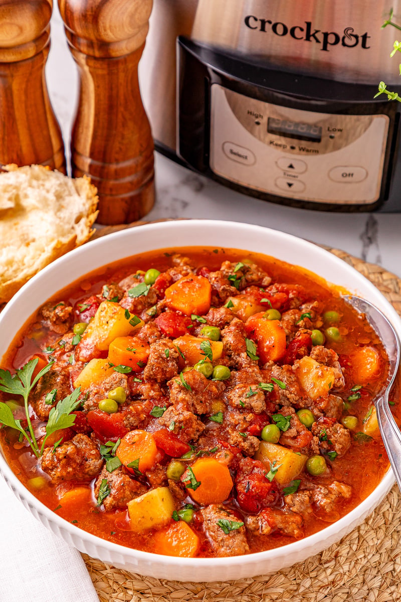 Finished dish of stew in white bowl.