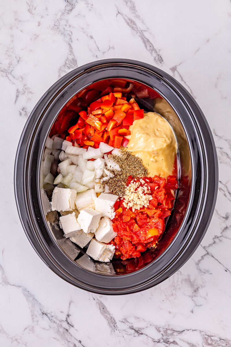 Remaining ingredients are added to the top of the chicken in crockpot.