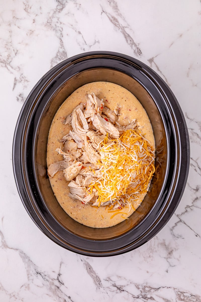 Cheese and chicken are added back to the crockpot.
