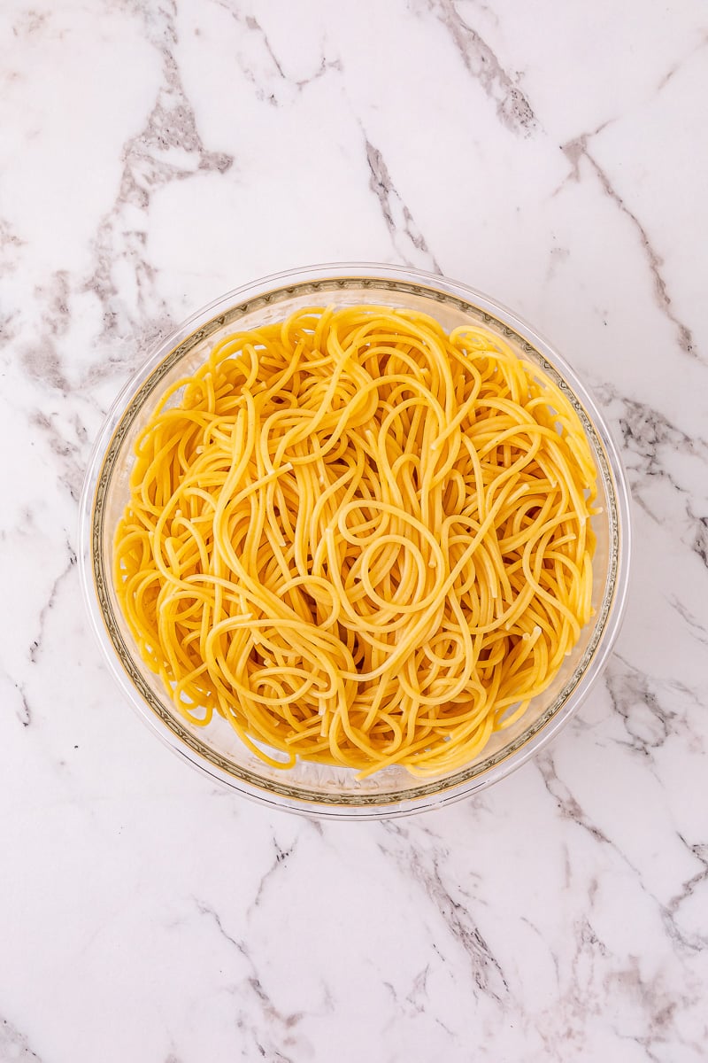 Cooked noodles in a glass bowl.