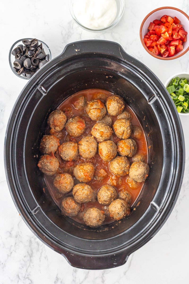 Slow cooker enchilada meatballs in crockpot.