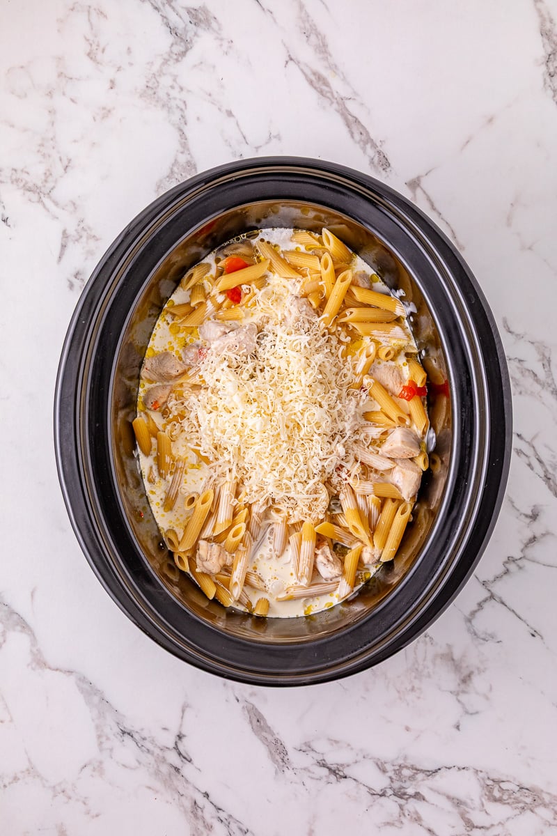Cheese is added to the top of the pasta mixture.