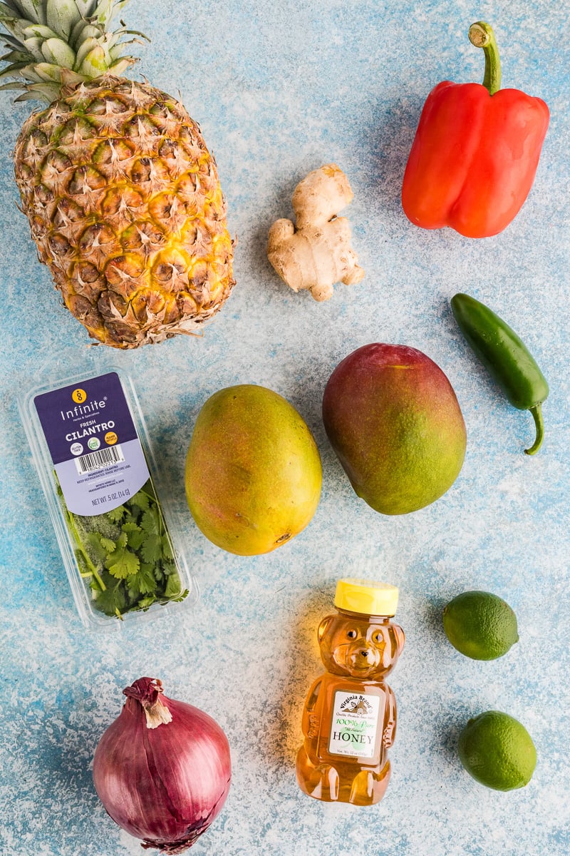 Mango salsa ingredients laid out on kitchen counter in preparation for the recipe.