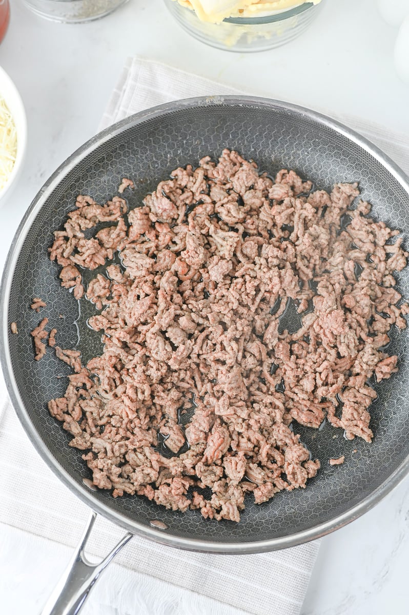 Cooked ground beef in skillet.