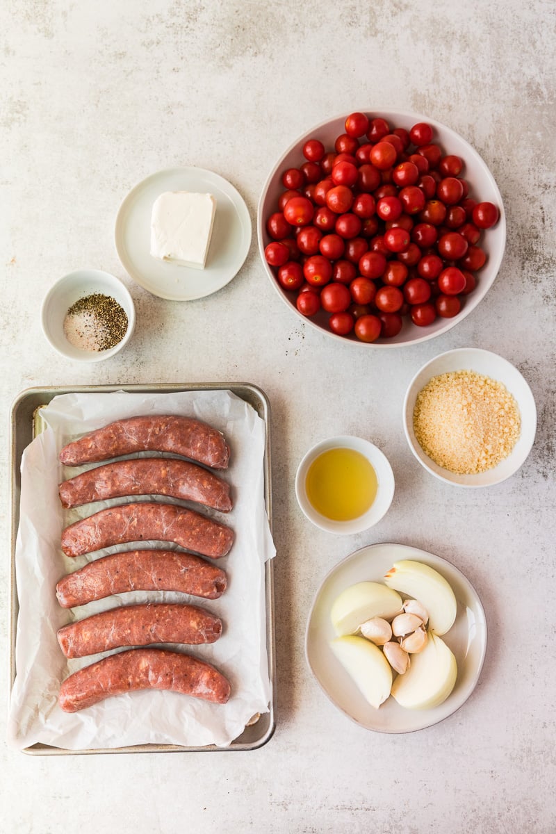 Ingredients for sausage rigatoni laid out on kitchen countertop in preparation for the recipe.