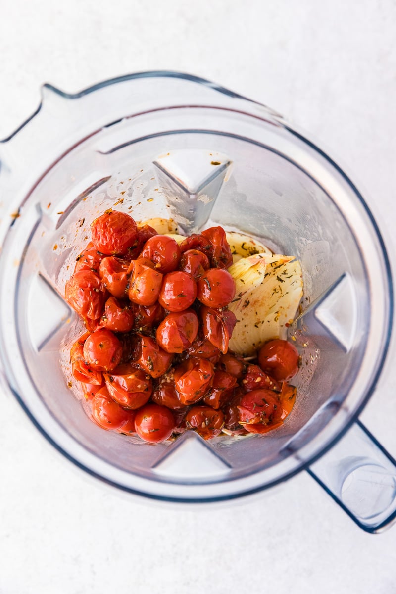 Roasted tomato mixture is placed in food processor.