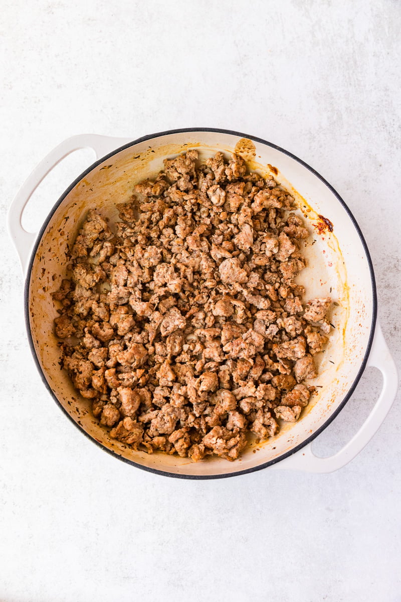 Cooked sausage in skillet.