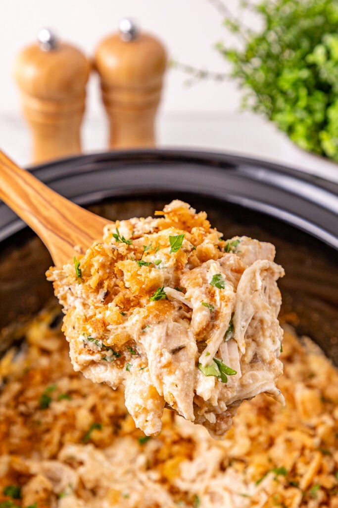 Crockpot Ritz cracker chicken scooped up on a spoon.