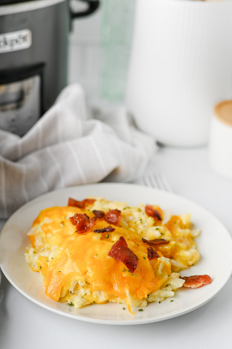 Crockpot hashbrown casserole on a white plate.