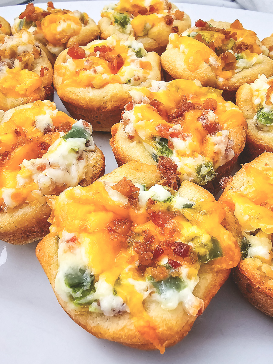 Jalapeno and bacon bites on a white plate.