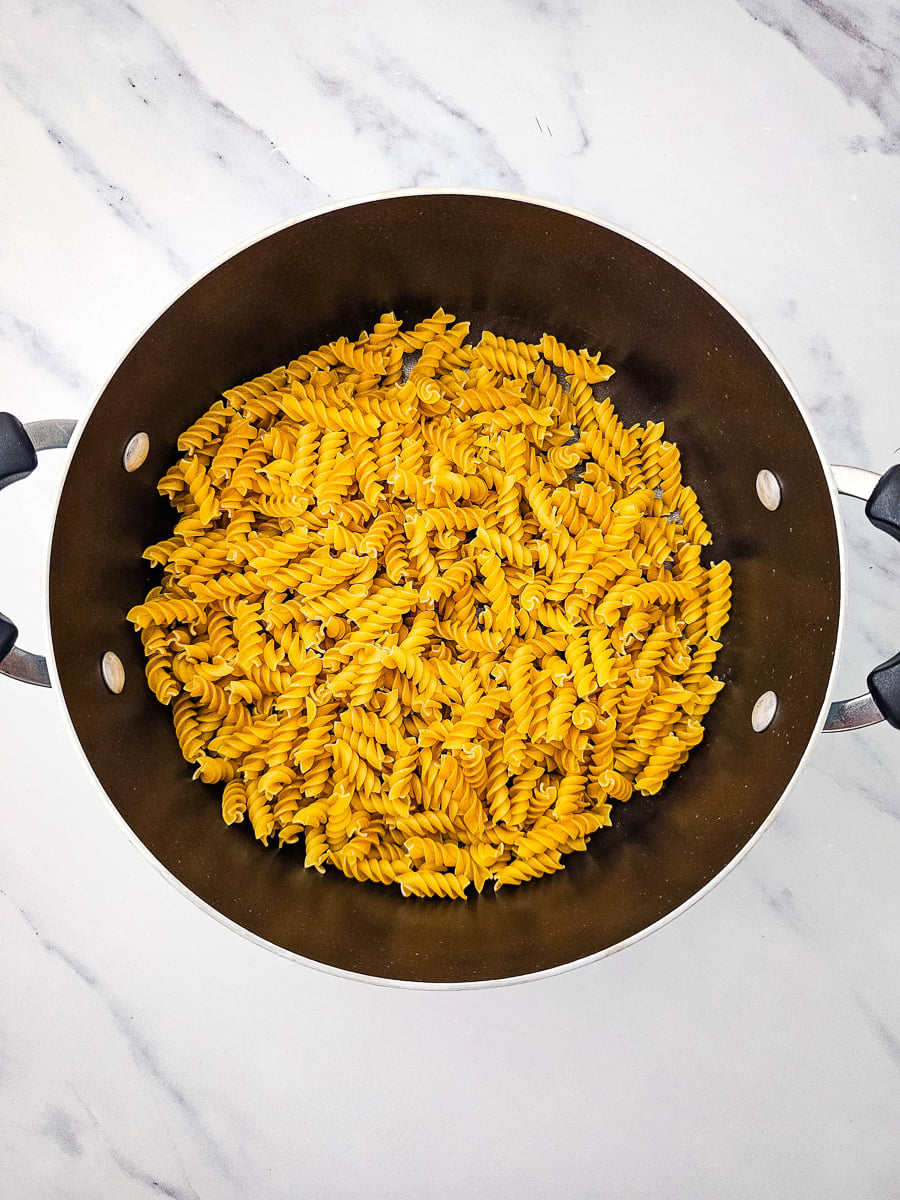 Pasta cooking in pot.