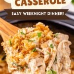 Ritz cracker chicken casserole scooped up on a spoon held over slow cooker.