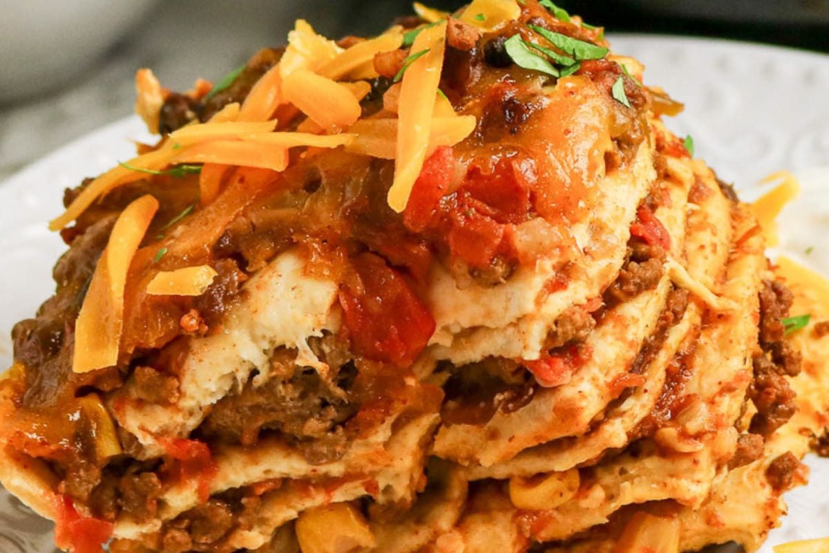 Serving of slow cooker taco casserole served on a white plate.