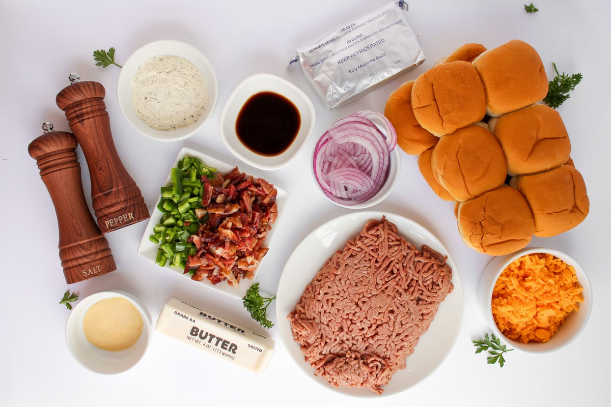 Ingredients for slider recipe laid out in small bowls on kitchen counter to prep the recipe.