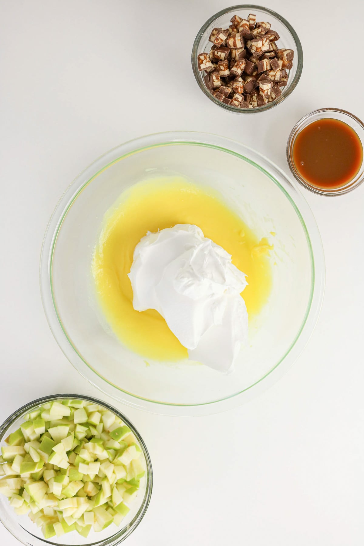 Instant pudding and whipped topping in glass bowl.