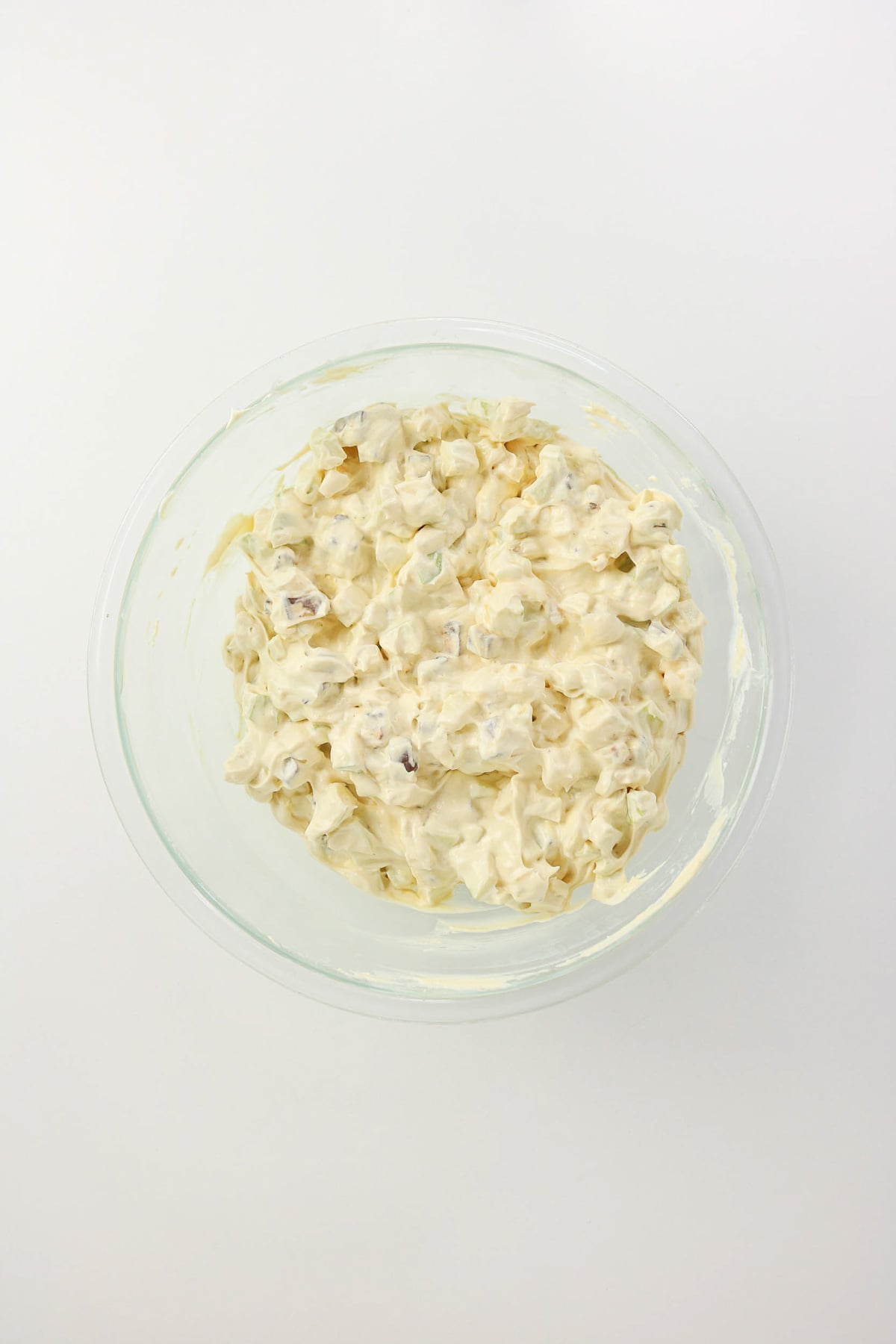 Apples and Snickers bar are stirred into the mixture.