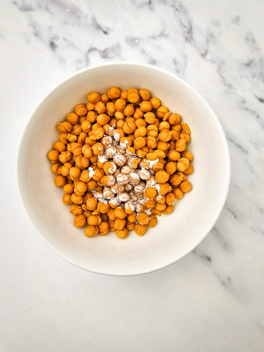 Caramel and heavy cream in microwaveable bowl.