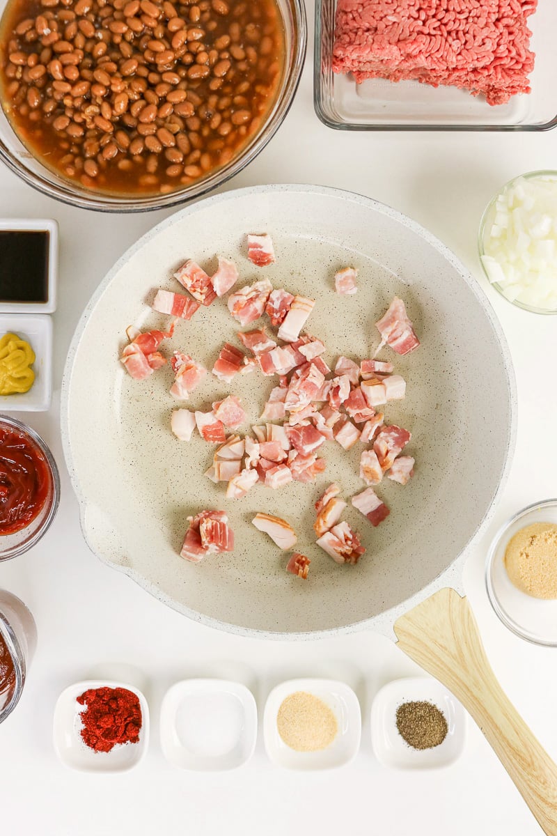 Bacon cooking in skillet.