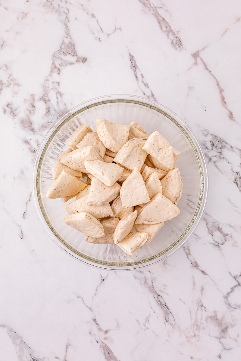 Biscuits, cut into quarters in small glass bowl.