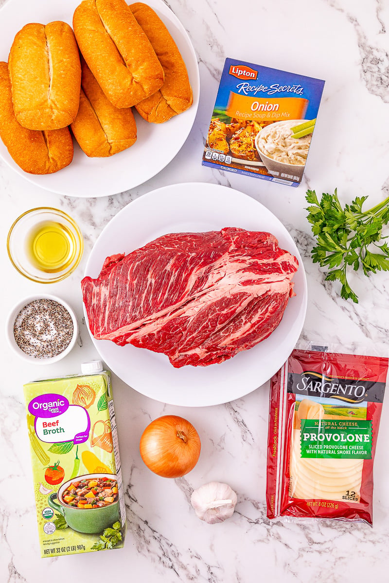 Ingredients for French dip sandwiches laid out on counter in preparation for the recipe.