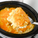 Hashbrown casserole in crockpot ready to serve.