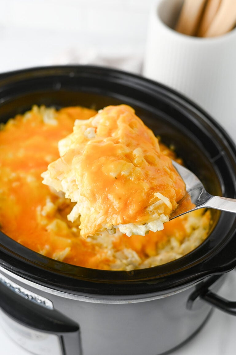 Hashbrown casserole in crockpot ready to serve.