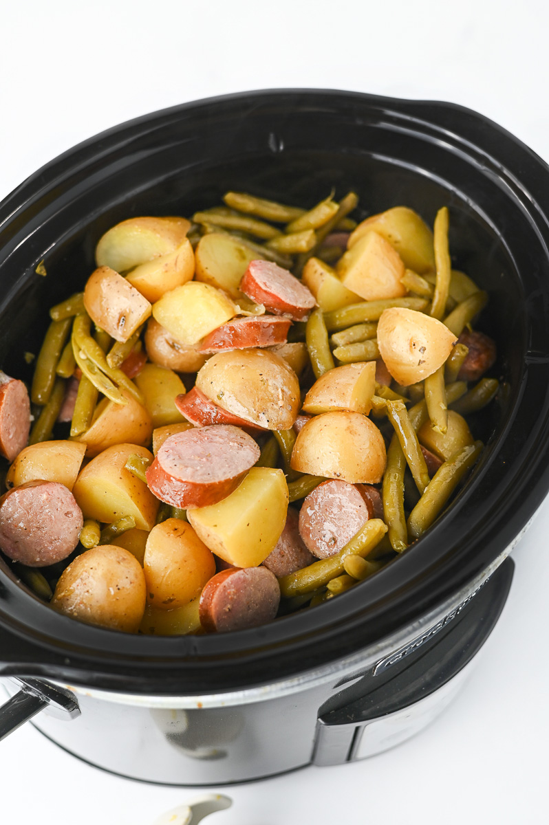 Crockpot swamp potatoes in slow cooker overhead view.