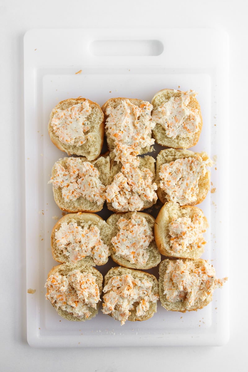 Top buns are spread with cream cheese mixture.