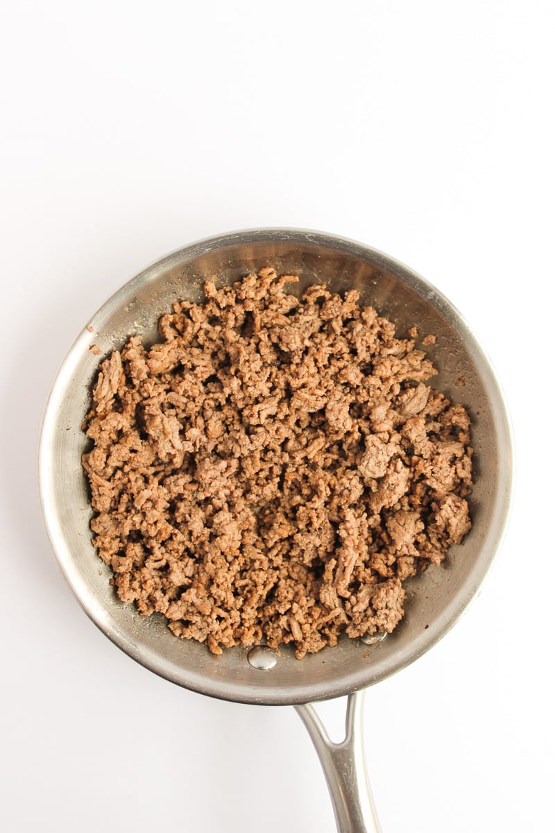 Cooked ground beef in skillet.