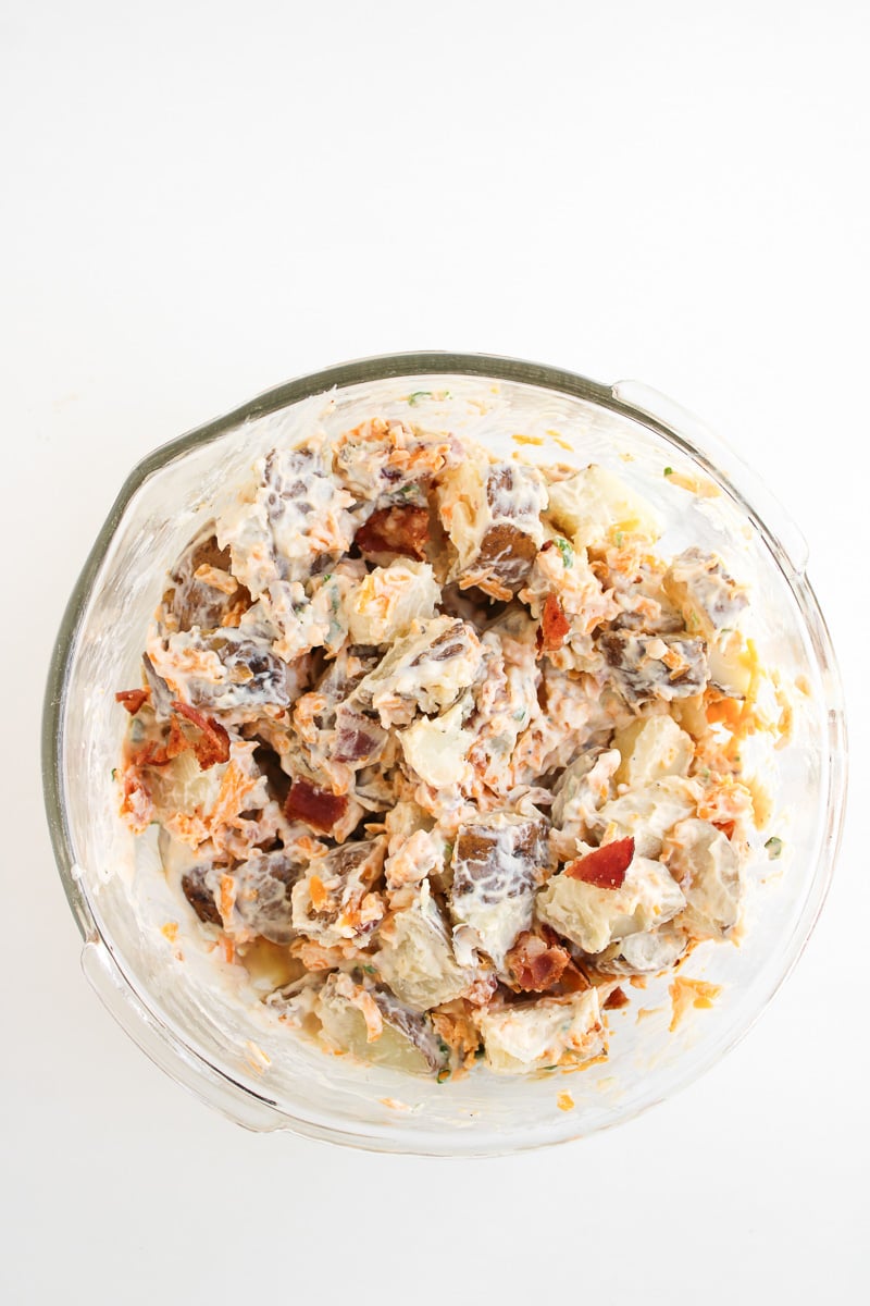 Salad is mixed in bowl ready to go into the fridge to chill.