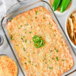 Hot jalapeno corn dip in glass baking dish, ready to be served.