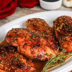 Maple glazed chicken served on a white plate.