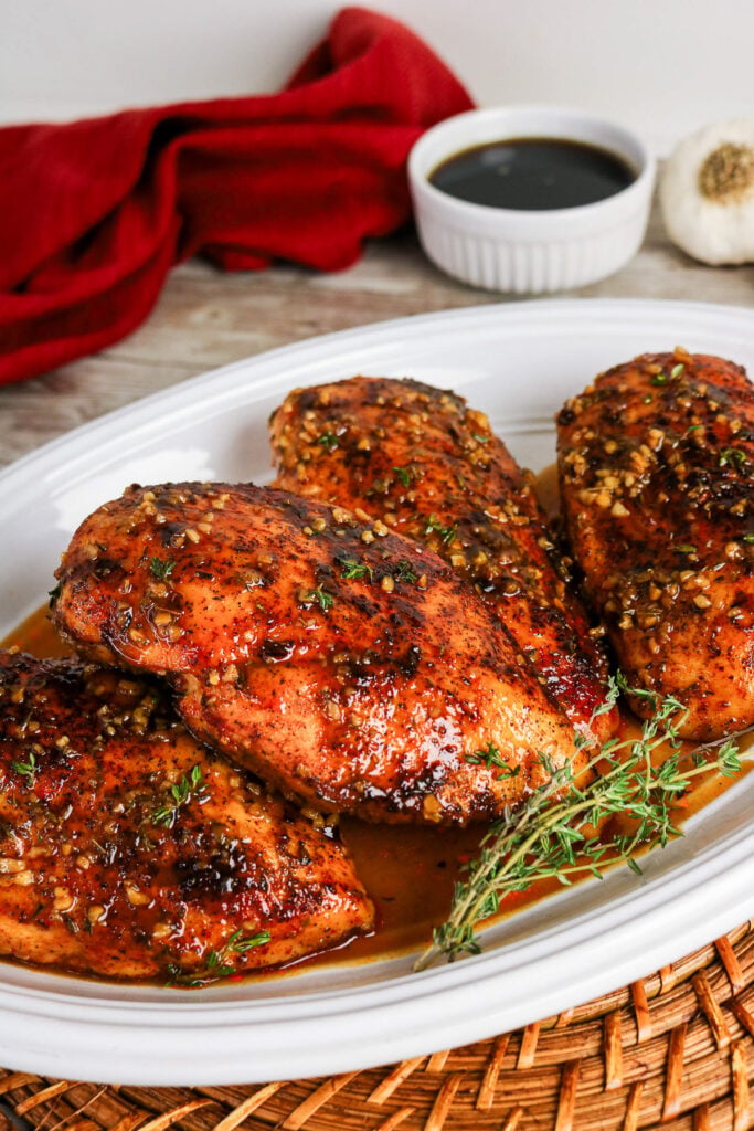 Maple glazed chicken served on a white plate.