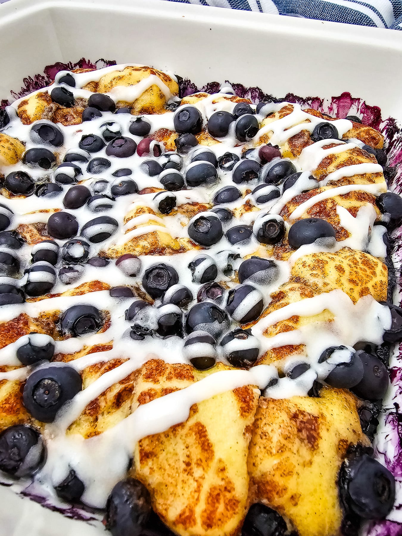 Blueberry cinnamon roll casserole in baking dish ready to be served.