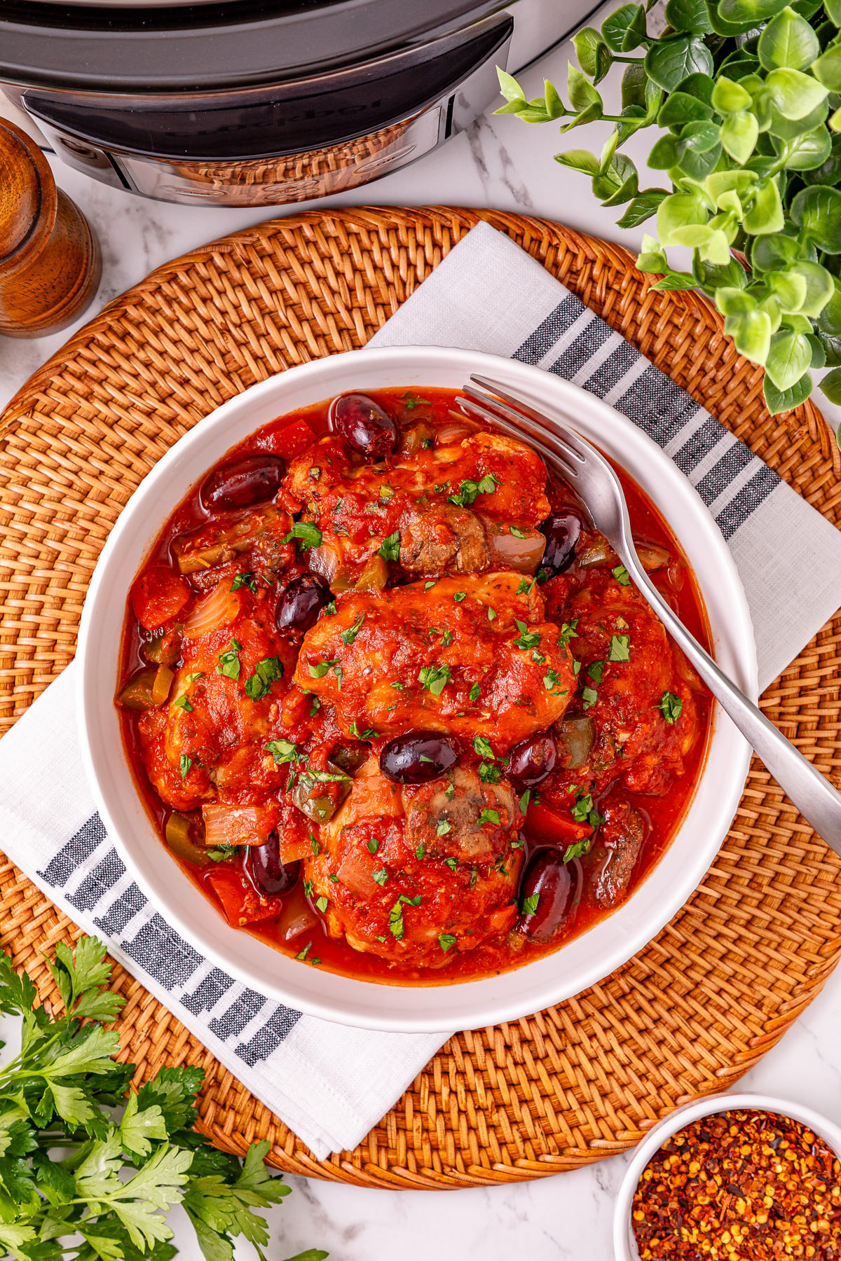 Plated crockpot chicken cacciatore.