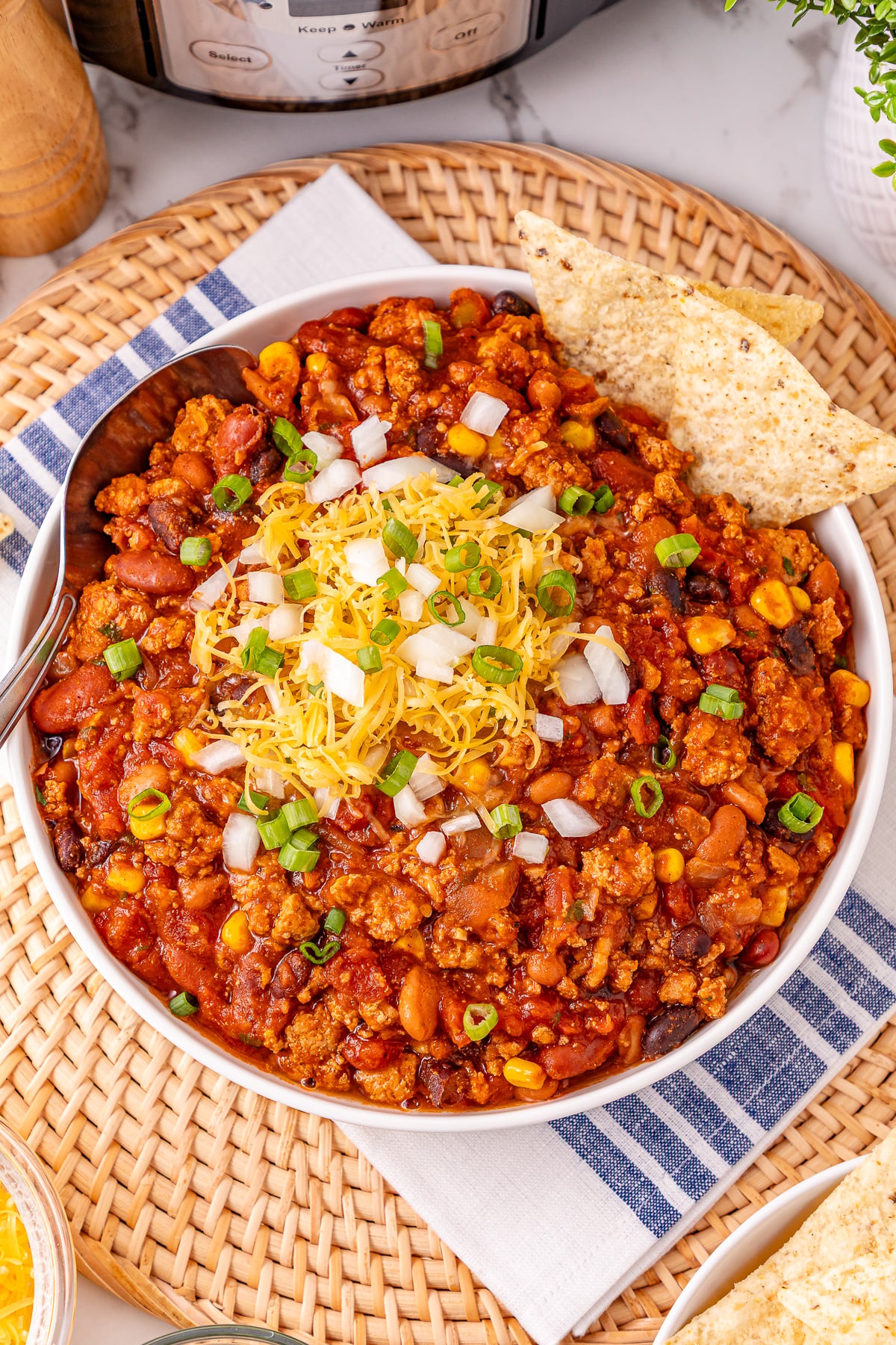 Crockpot turkey chili served in a white bowl.