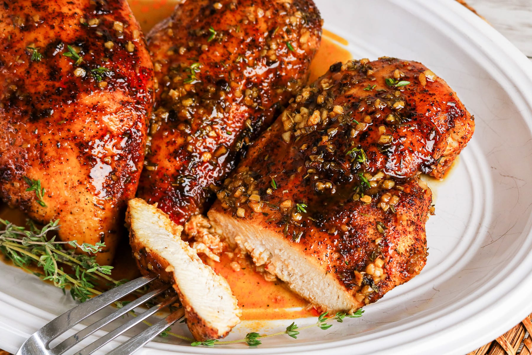 Maple chicken on a white plate.