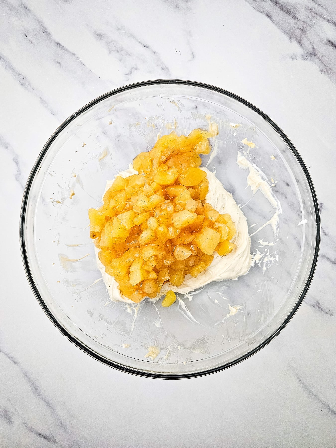 Apple pie filling is folded into the cream cheese mixture.