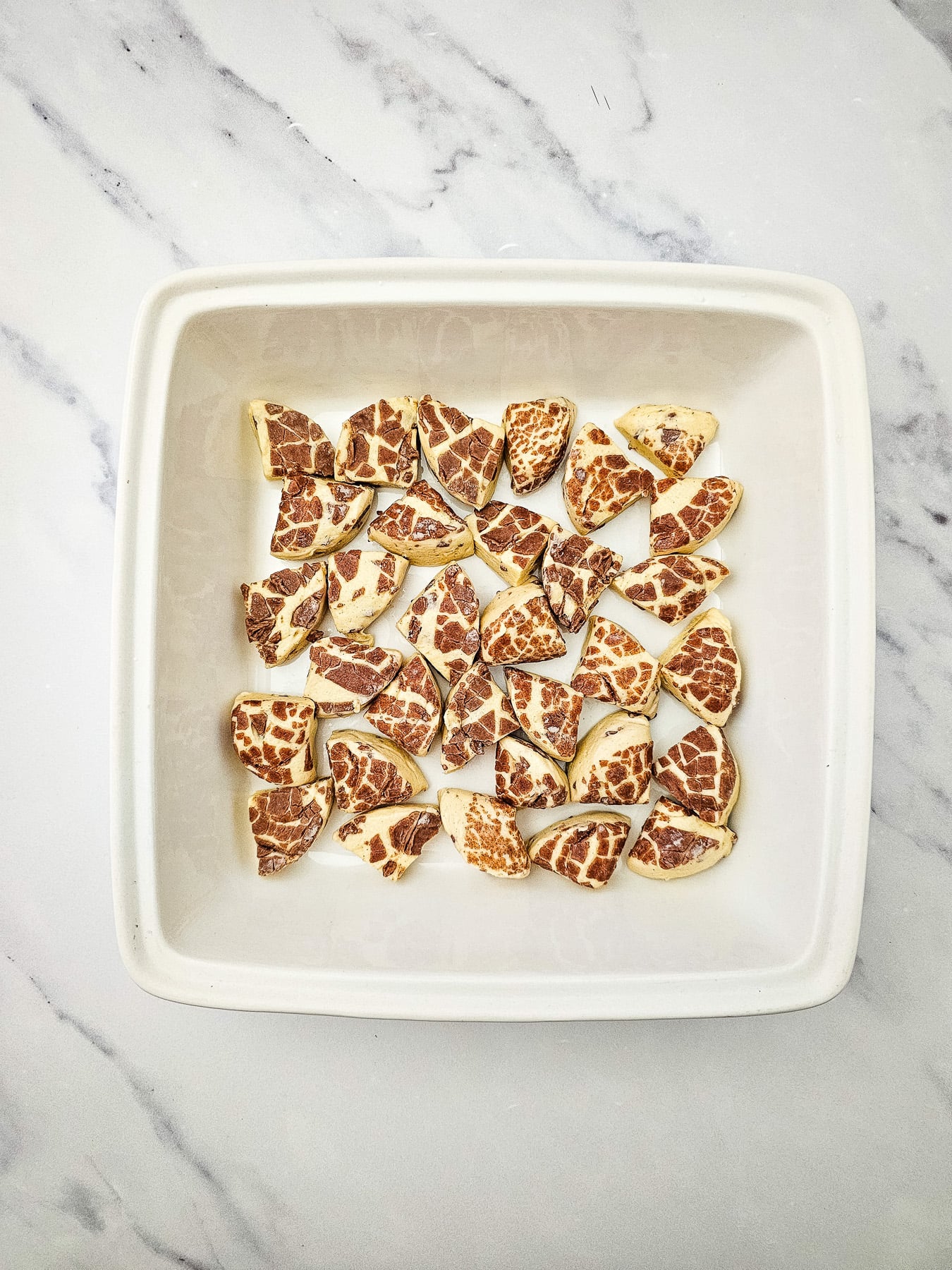 Cut cinnamon rolls place in bottom of baking dish.