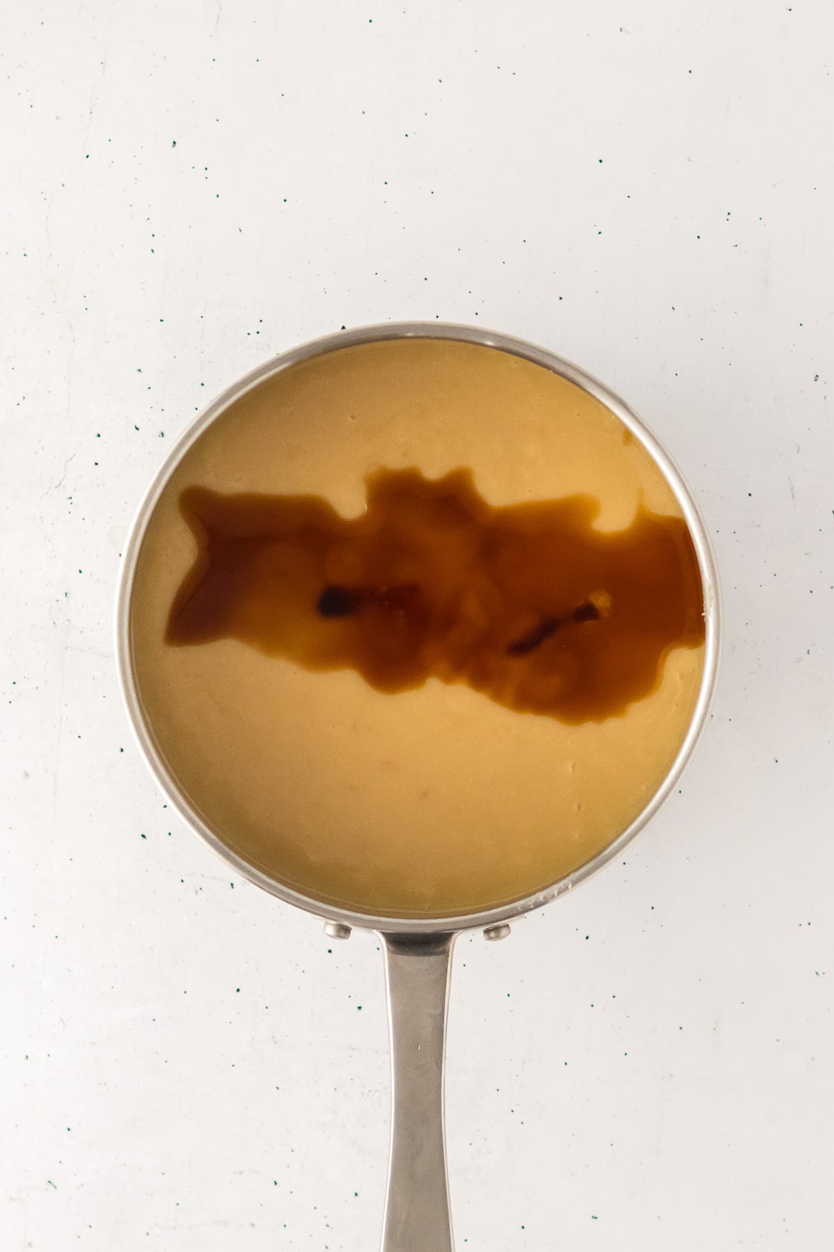 Vanilla is added to the mixture in saucepan.