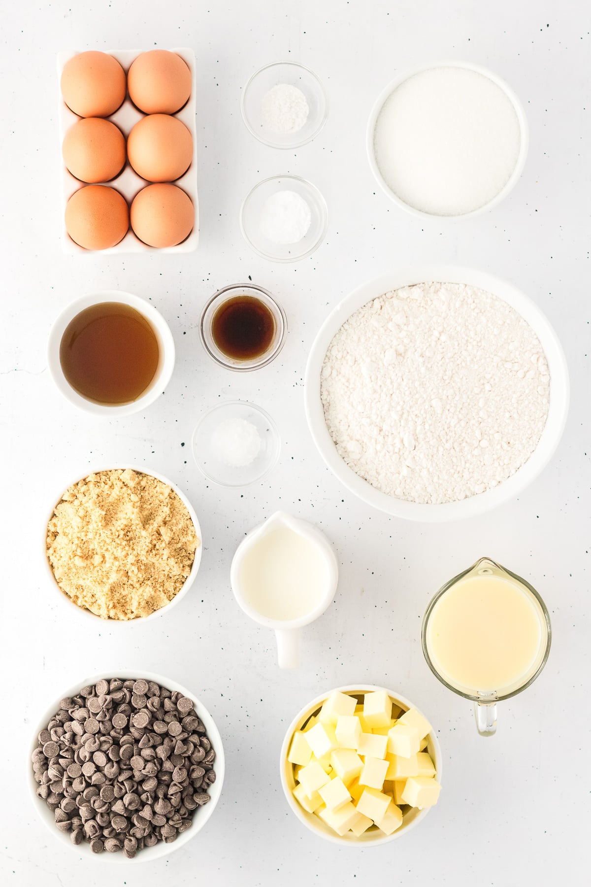Chocolate chip millionaire bar ingredients in small bowl on counter.