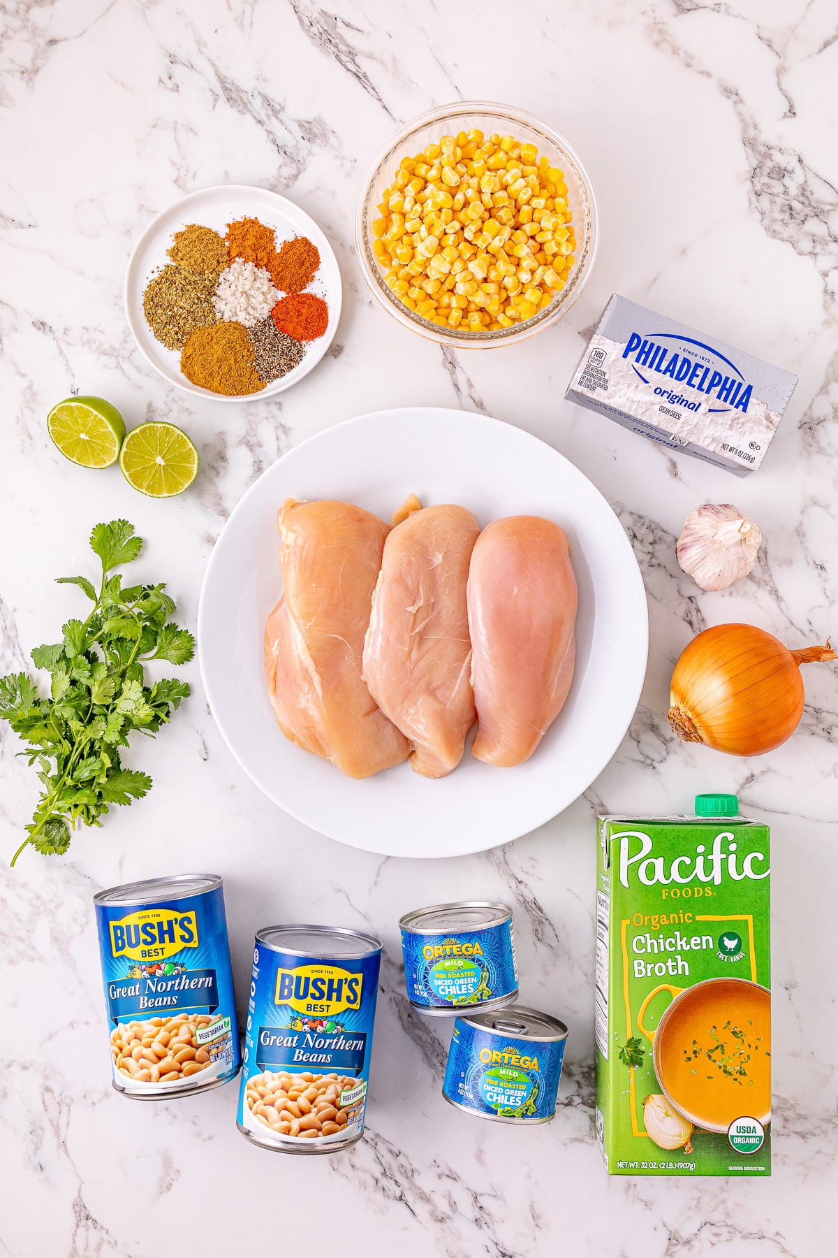Ingredients for white chicken chili laid out in small bowls on counter.