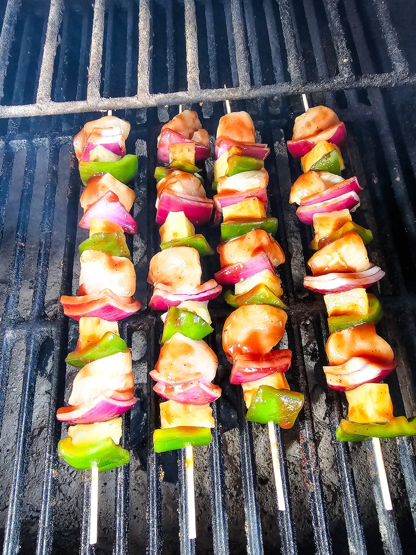 Chicken kabobs on grill.