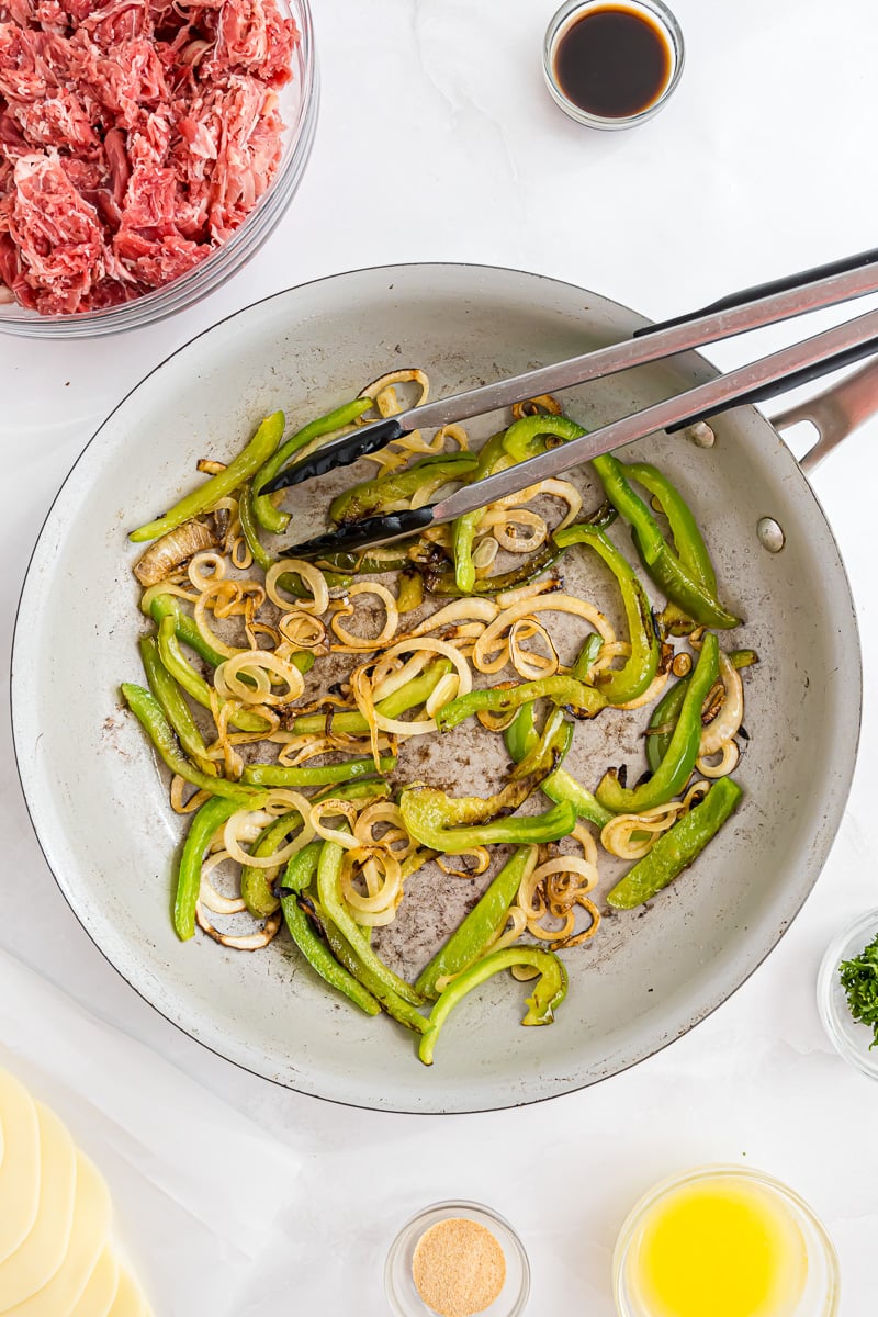 Peppers and onions in skillet.
